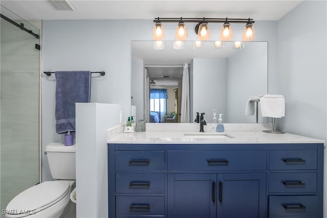 full bathroom with toilet, vanity, visible vents, and a shower with door