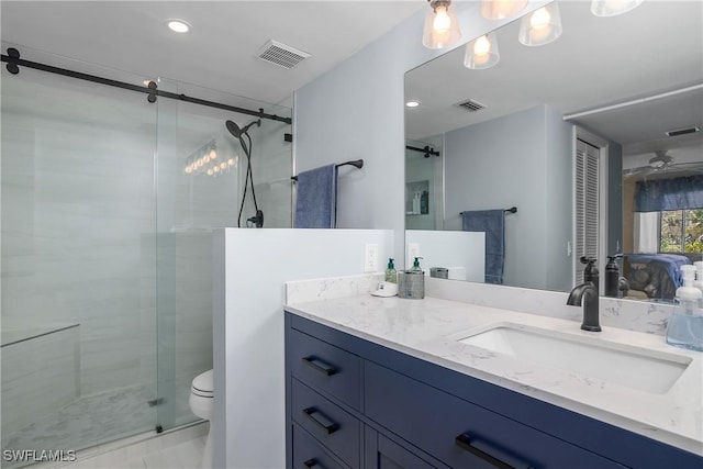 bathroom with toilet, a shower stall, visible vents, and vanity