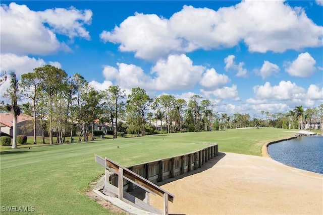 view of home's community featuring a water view and a yard