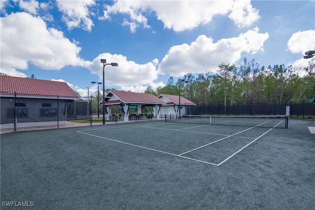 view of sport court with fence