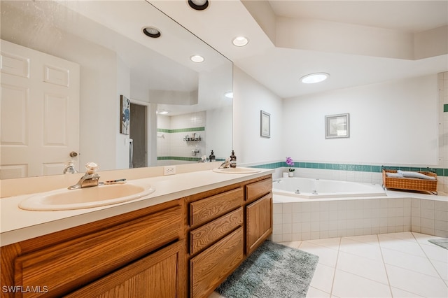 full bathroom featuring a sink, a bath, tile patterned floors, double vanity, and a stall shower