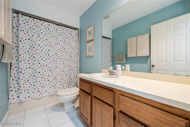 bathroom featuring shower / tub combo with curtain, vanity, toilet, and tile patterned floors