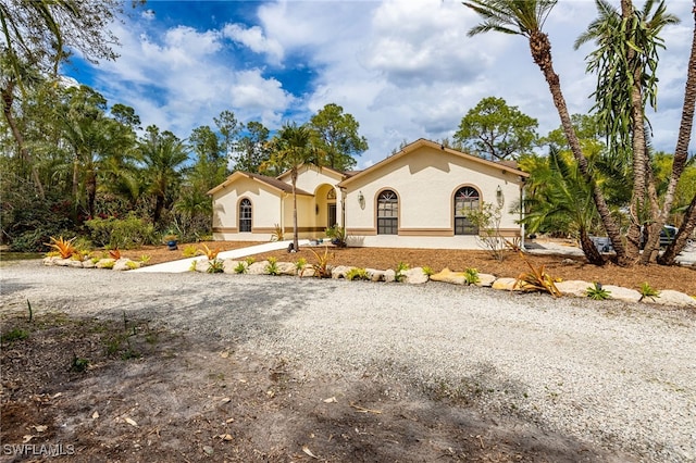 mediterranean / spanish-style house featuring stucco siding