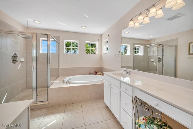 bathroom featuring a garden tub, visible vents, vanity, a shower stall, and tile patterned floors