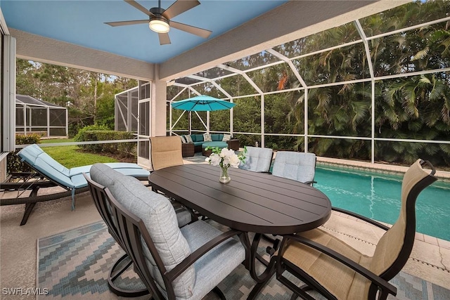 pool with an outdoor hangout area, ceiling fan, a patio area, and a lanai