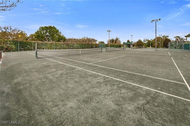 view of sport court with fence