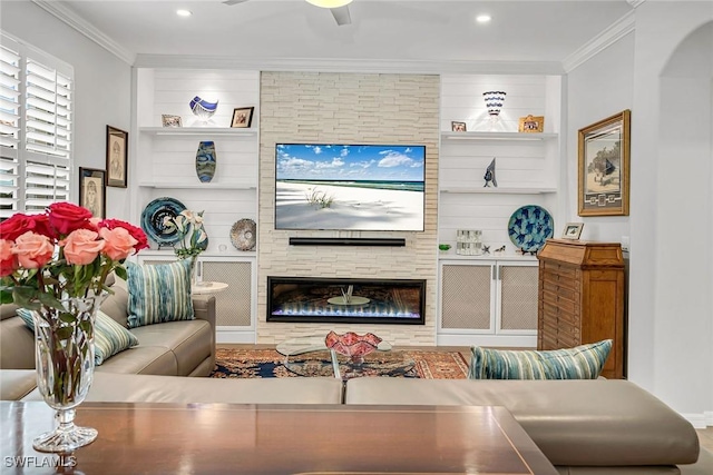 living room with ceiling fan, a fireplace, crown molding, and recessed lighting