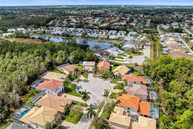 bird's eye view featuring a water view and a residential view