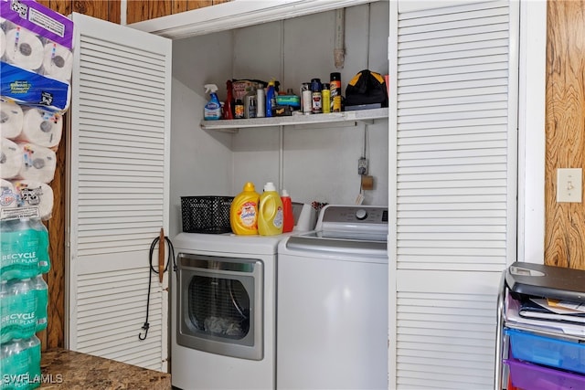 clothes washing area with laundry area and washer and clothes dryer