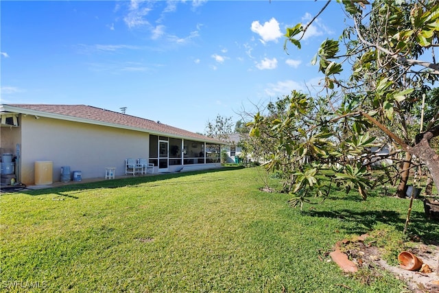 view of yard featuring a sunroom