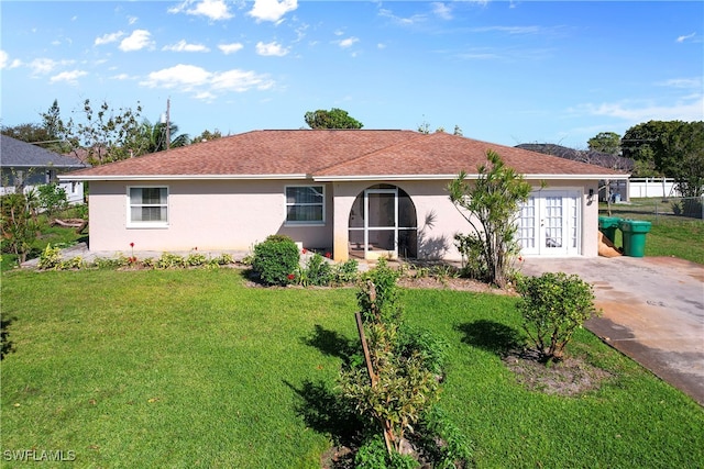 single story home with a front yard and stucco siding