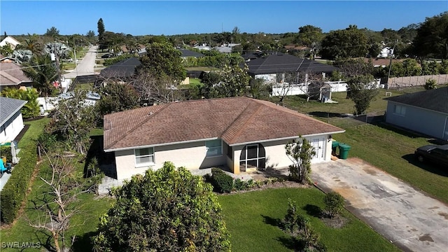 birds eye view of property with a residential view