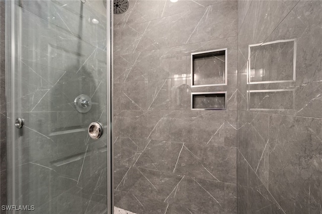 full bath featuring a shower stall