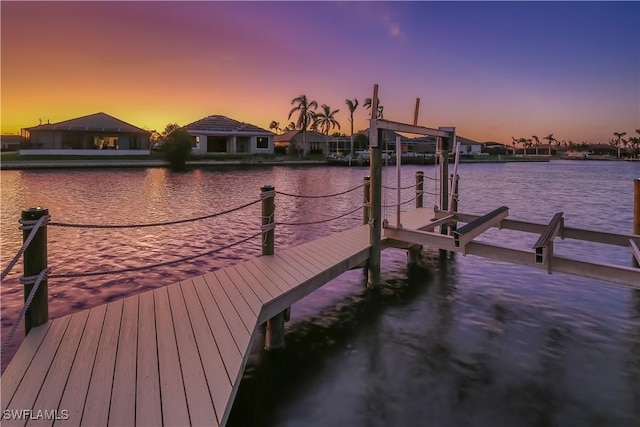 view of dock with a water view and boat lift