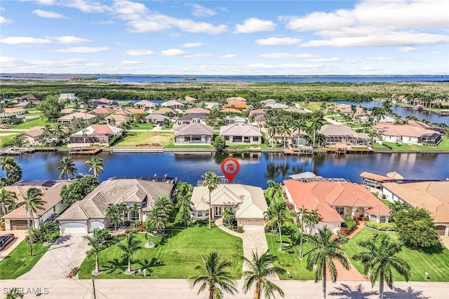 aerial view featuring a residential view and a water view