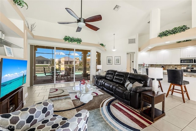 living room with light tile patterned floors, ceiling fan, and visible vents