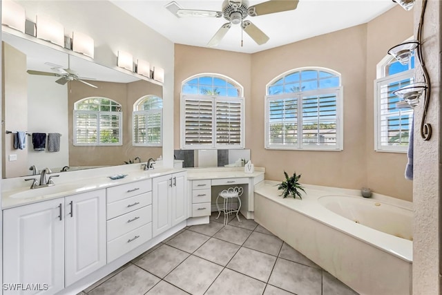 bathroom with double vanity, ceiling fan, a sink, and tile patterned floors