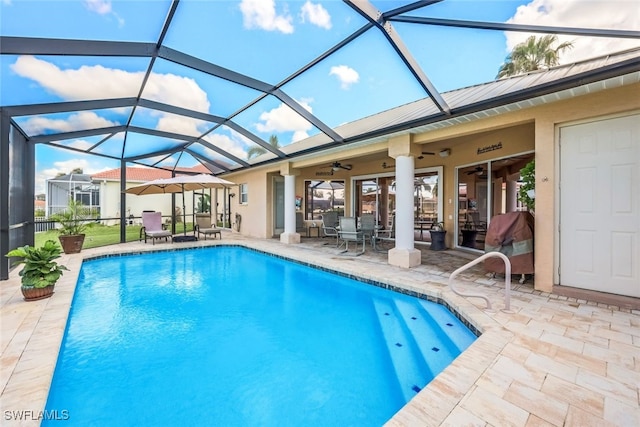 pool featuring ceiling fan, a patio, and a lanai