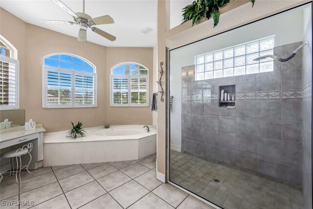 bathroom with tile patterned flooring, a garden tub, visible vents, and walk in shower