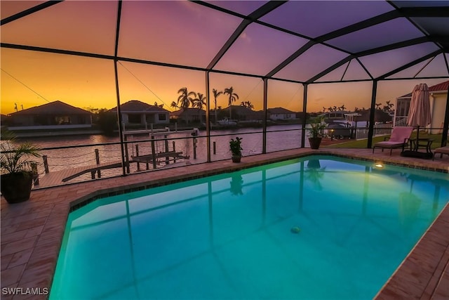 pool featuring a lanai and a patio area