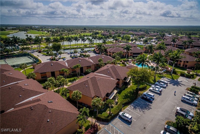 bird's eye view featuring a residential view and a water view