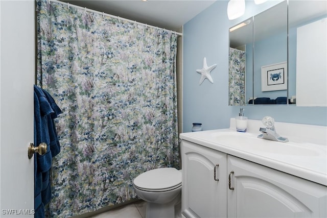 bathroom featuring vanity, curtained shower, tile patterned flooring, and toilet