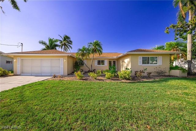 ranch-style home with a garage, concrete driveway, a front lawn, and stucco siding