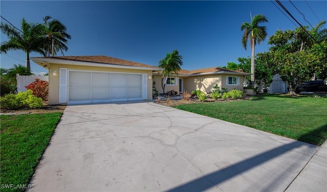 ranch-style home featuring a garage, concrete driveway, a front lawn, and stucco siding