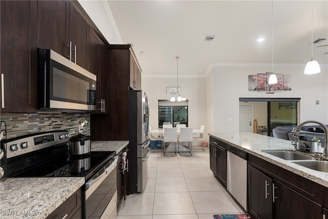 kitchen featuring tasteful backsplash, visible vents, appliances with stainless steel finishes, a sink, and light tile patterned flooring