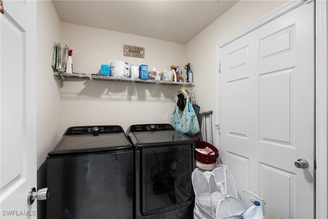 laundry area featuring laundry area and washer and dryer