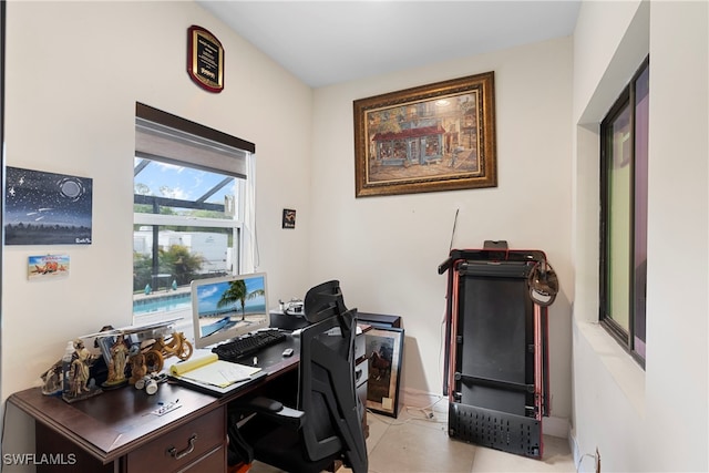 office area with light tile patterned floors