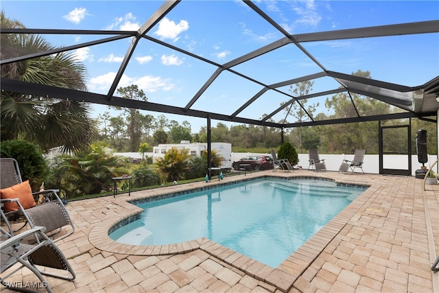 pool with a patio and a lanai