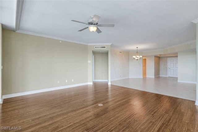 empty room featuring visible vents, baseboards, wood finished floors, and ceiling fan with notable chandelier