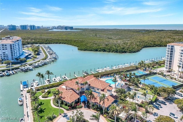 drone / aerial view featuring a water view and a view of city