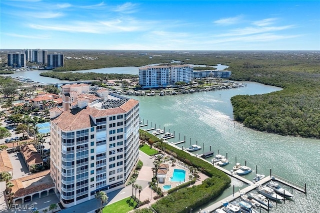 bird's eye view featuring a water view and a view of city