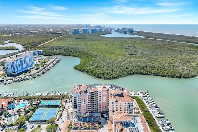 birds eye view of property featuring a view of city and a water view