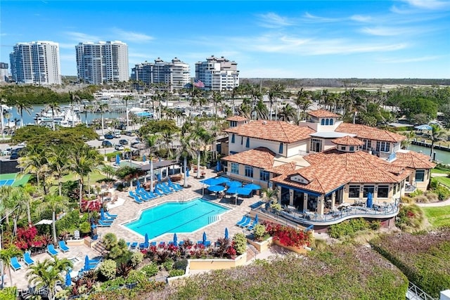 drone / aerial view with a city view and a water view