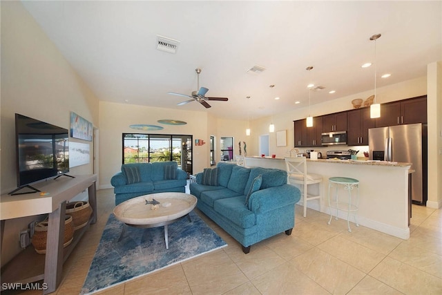 living room featuring light tile patterned floors, visible vents, a ceiling fan, and recessed lighting