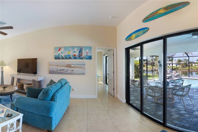 living area featuring light tile patterned floors, baseboards, visible vents, a sunroom, and ceiling fan