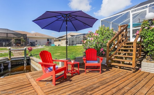 deck featuring stairs, a yard, and a lanai