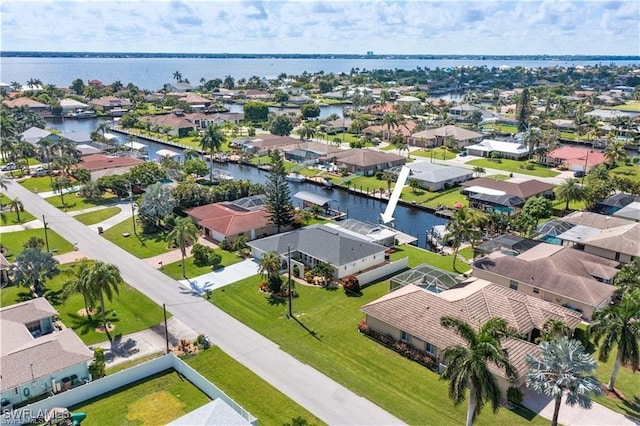 bird's eye view with a residential view and a water view