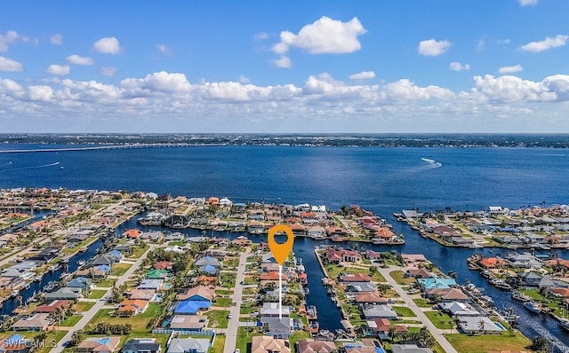 birds eye view of property featuring a residential view and a water view