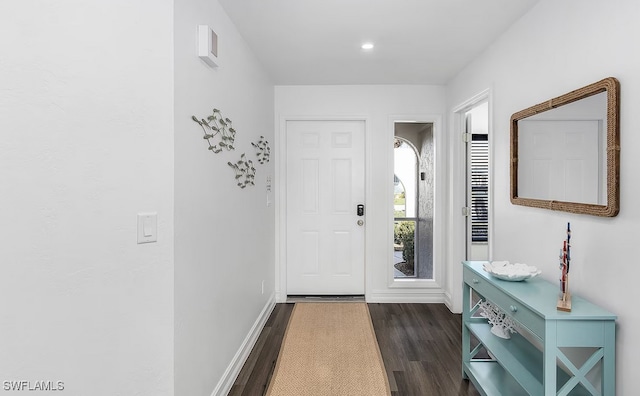 doorway to outside with dark wood-type flooring, recessed lighting, and baseboards