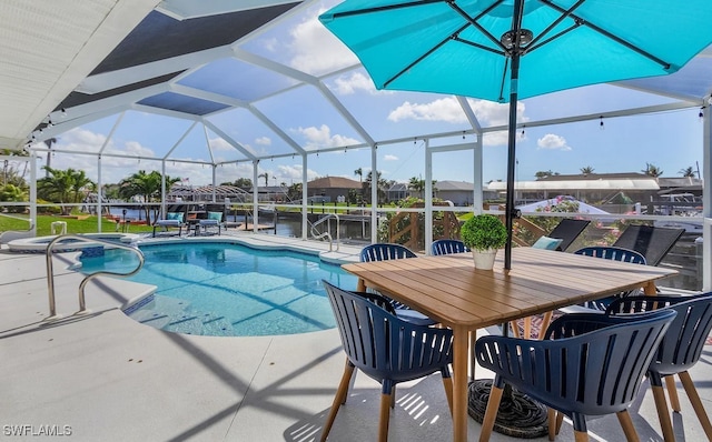 view of swimming pool with glass enclosure, outdoor dining area, a patio area, and a pool with connected hot tub