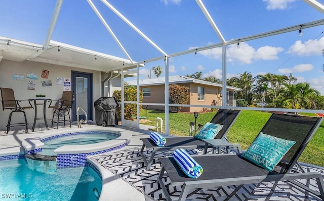 view of pool with grilling area, outdoor dry bar, a lanai, a yard, and a patio area