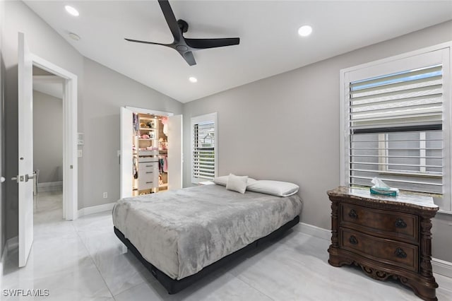 bedroom featuring baseboards, ceiling fan, a spacious closet, vaulted ceiling, and recessed lighting