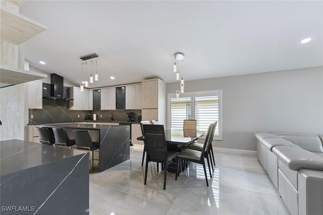 dining space featuring baseboards and recessed lighting