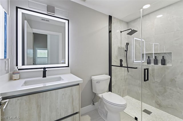 full bathroom with toilet, visible vents, vanity, baseboards, and a shower stall