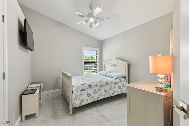 bedroom featuring lofted ceiling, ceiling fan, baseboards, and arched walkways