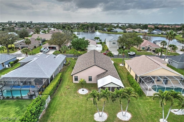 aerial view featuring a residential view and a water view